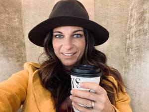 Emily with hat and coffee